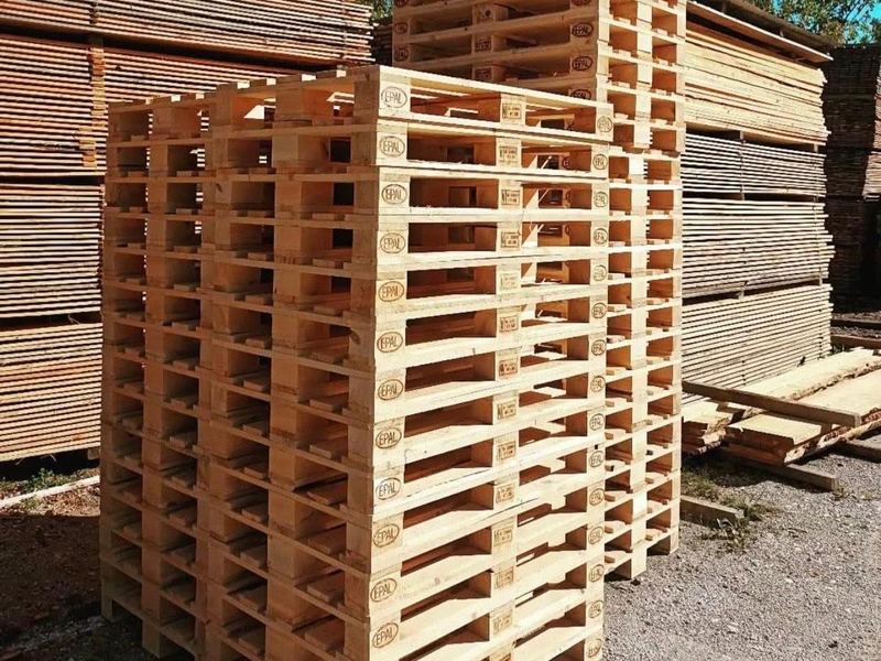 Wooden pallets stacked in yard